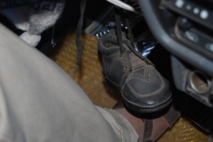 Baby Shoes Under the Steerwing Wheel as Good Luck guides