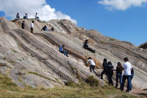 Teenegers Playing in a Rock slide in Sacsayhuaman