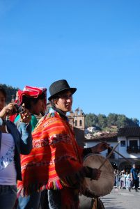 Musician Directing Dance Troupe in Cuzco Festival