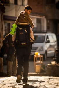 Carrying a Child through Cuzco's Streets (Walter Coraza Morveli)